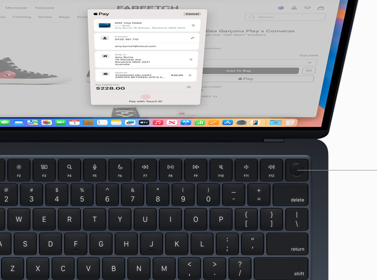 MacBook Air showing user authorising payment for online shopping purchase using Touch ID