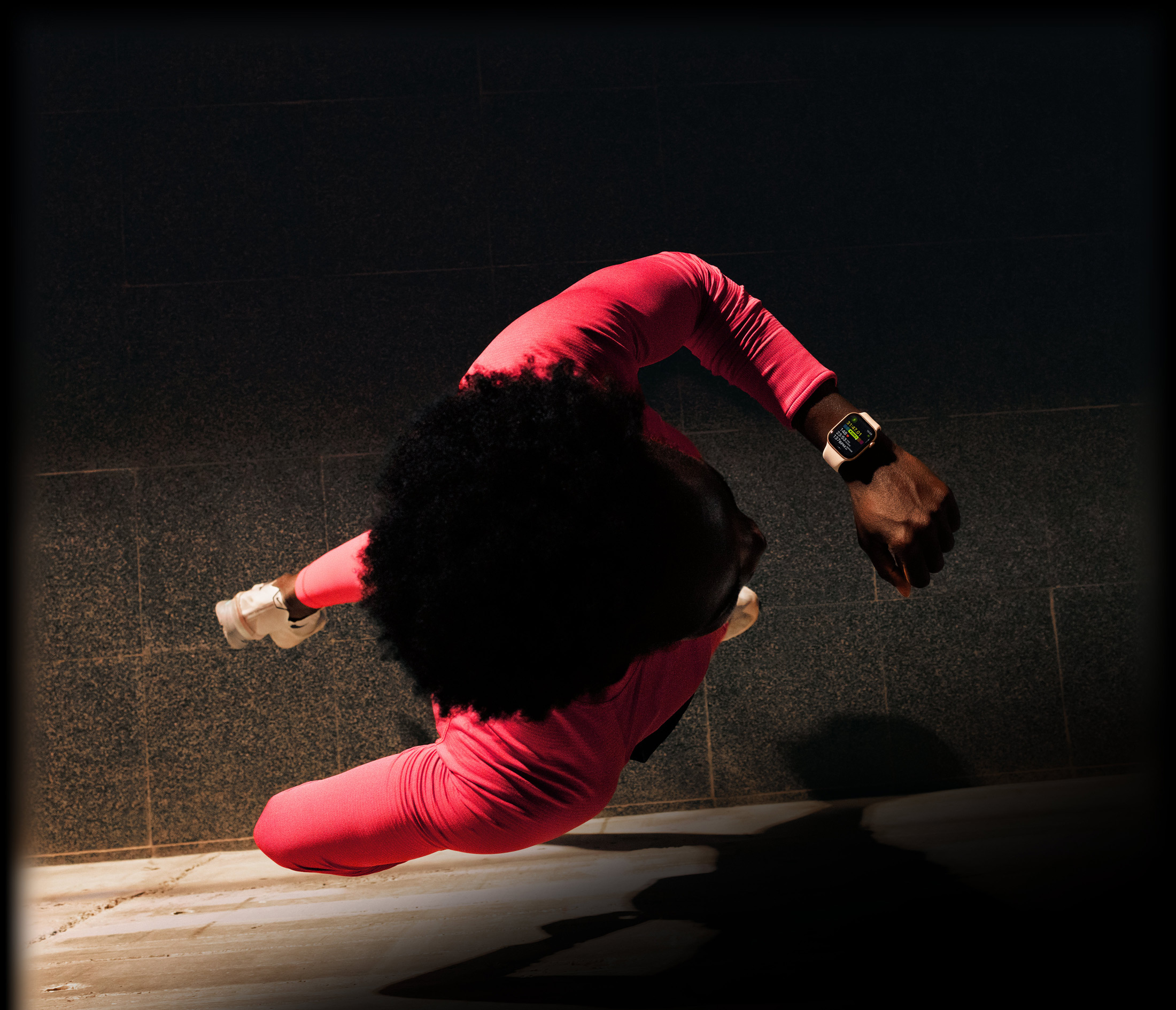 A person checks progress on Apple Watch Series 11 Workout app while running