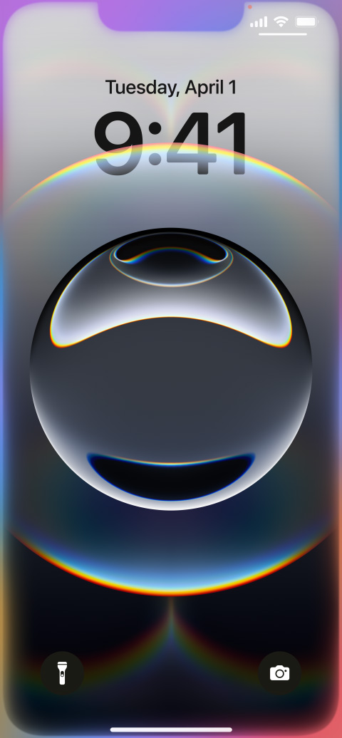 Hand holding iPhone 16e with colourful glowing edges around the Lock Screen.